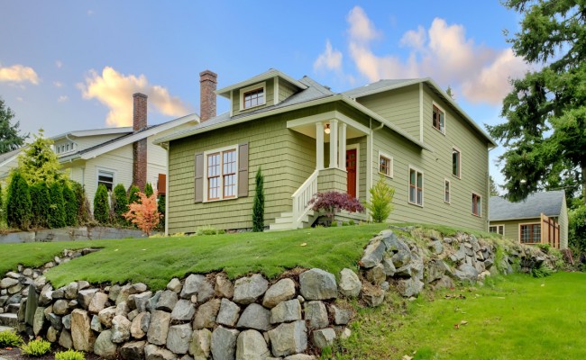 Craftsman green cute house exterior front.